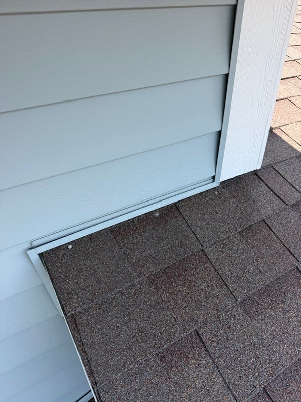 Flashing along a roof-to-siding transition