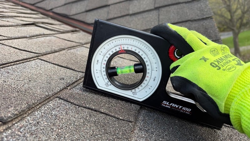 Roof slope measuring tool on shingles